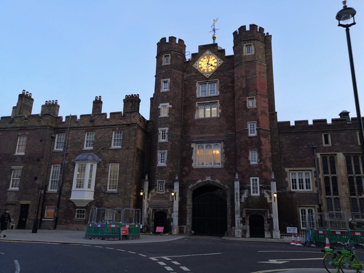 The red brick Tudor gatehouse of St James's Palace with its clock tower