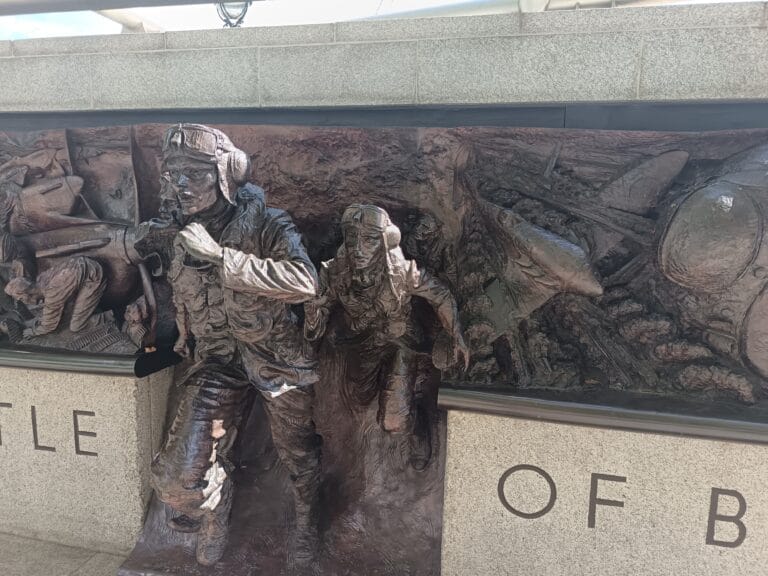 Bronze figures of two airmen scrambling for their aircraft on the Battle of Britain Monument